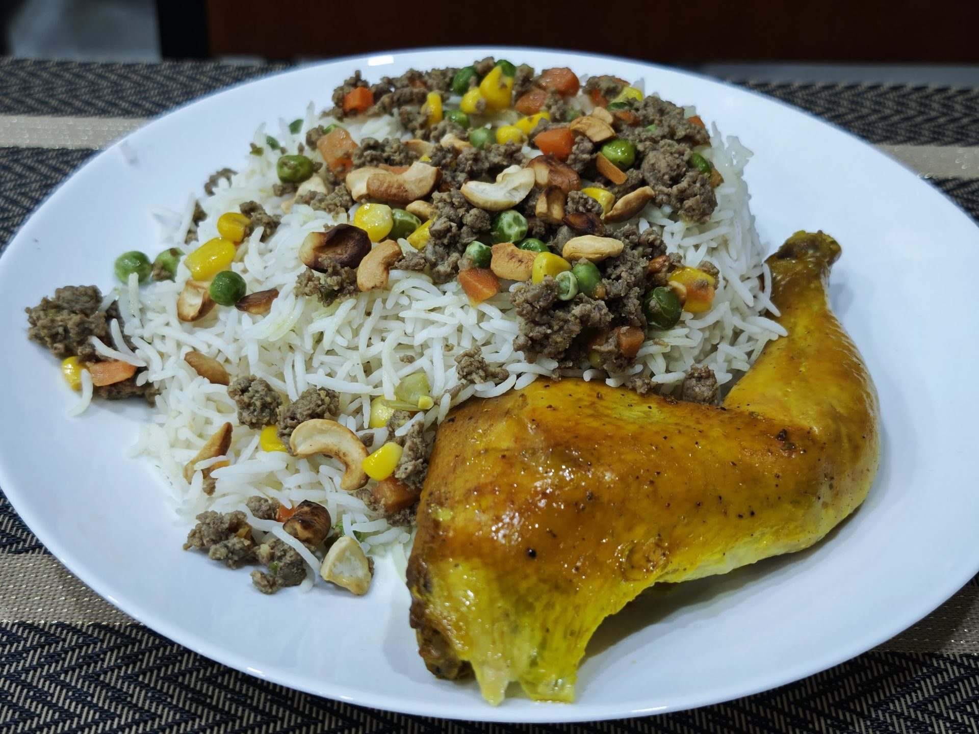 A platter of Palestinian ozi chicken with rice, minced meat and nuts